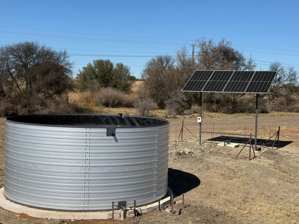 Completed Waterinfra Zinc-Al reservoir reflecting sunlight